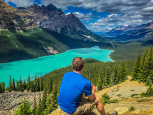 Self-portrait taken on a road-trip through Canada. This is Peyto Lake in Banff National Park - Alberta, Canada. Lifestyle Blogger. Lifestyle Influencer. Lifestyle Photography.