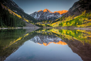 Landscape photograph of Maroon Bells outside of Aspen, Colorado at sunrise during fall.